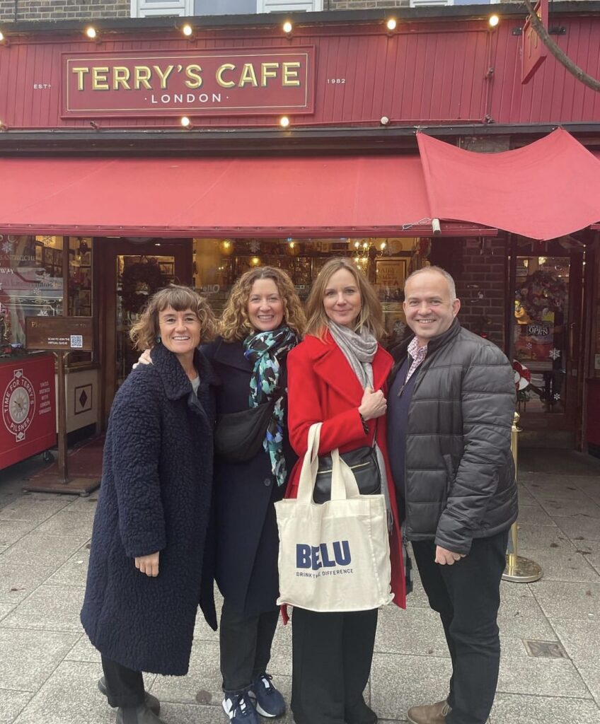 Image of four people with a Belu branded tote bag
